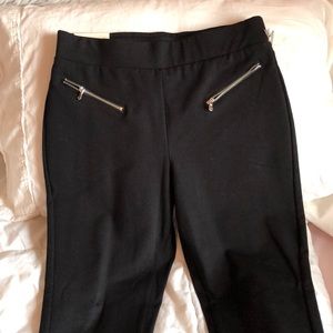 black pants with front zippers